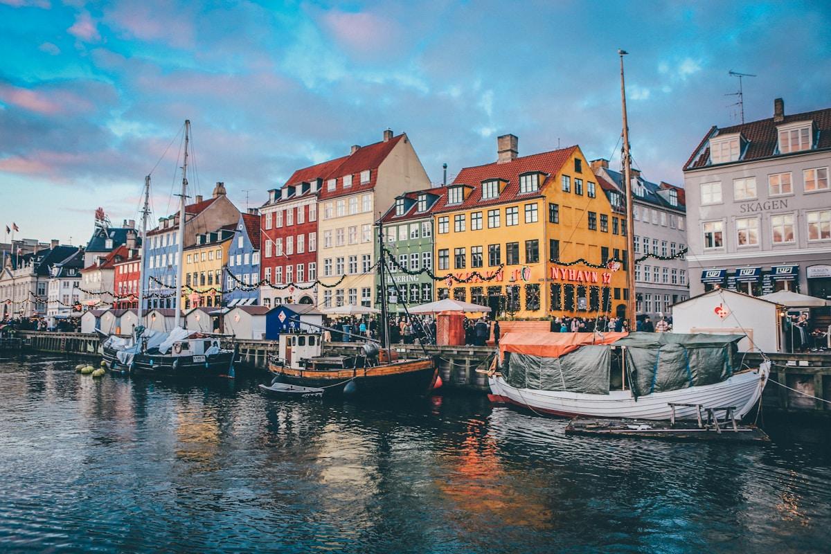Colourful buildings along the Nyhavn waterfront in Copenhagen, Denmark, representing student life in Denmark