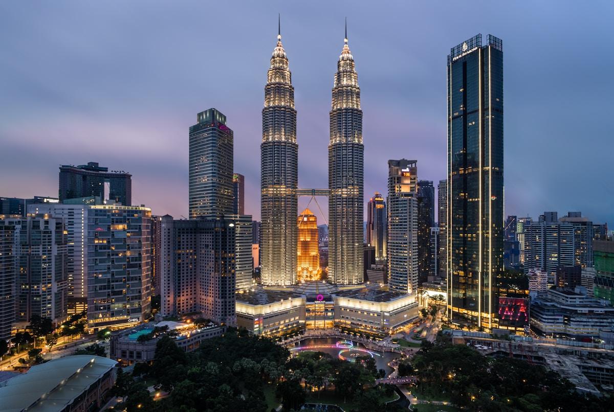 Kuala Lumpur skyline with Petronas Towers and modern university campus buildings
