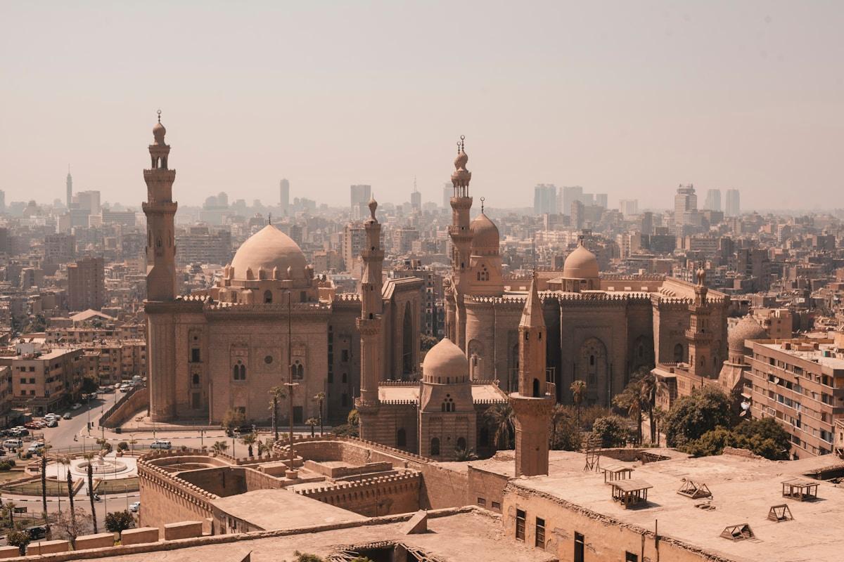 Cairo skyline with pyramids and modern city buildings in Egypt