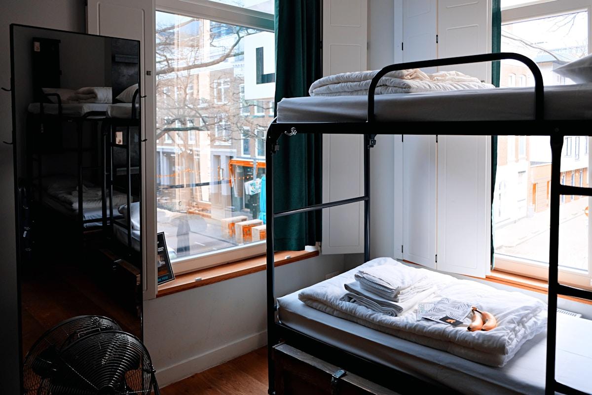 Student dormitory room with desk and bed representing university accommodation options abroad