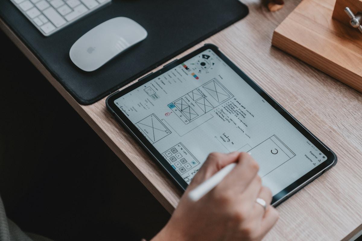 Designer working on user interface wireframes representing UX design career
